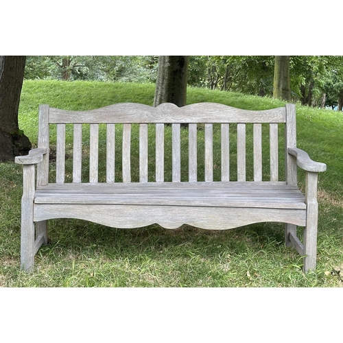 157 - GARDEN BENCH BY BRIDGMAN & CO, well weathered teak with shaped, incised top rail, slatted seat and s... 