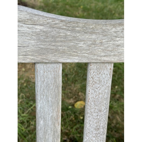 157 - GARDEN BENCH BY BRIDGMAN & CO, well weathered teak with shaped, incised top rail, slatted seat and s... 