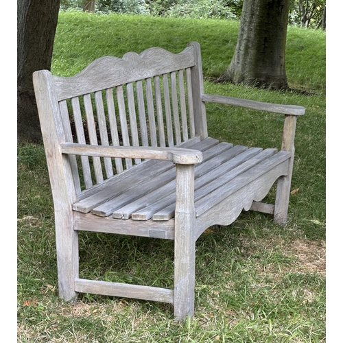 157 - GARDEN BENCH BY BRIDGMAN & CO, well weathered teak with shaped, incised top rail, slatted seat and s... 