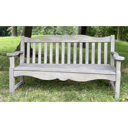 157 - GARDEN BENCH BY BRIDGMAN & CO, well weathered teak with shaped, incised top rail, slatted seat and s... 