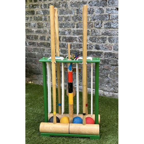 220 - CROQUET SET, a vintage set on portable stand, 46cm x 99cm H.