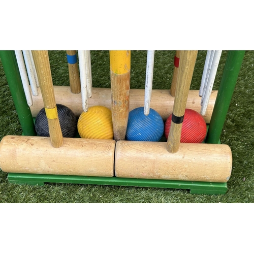 220 - CROQUET SET, a vintage set on portable stand, 46cm x 99cm H.