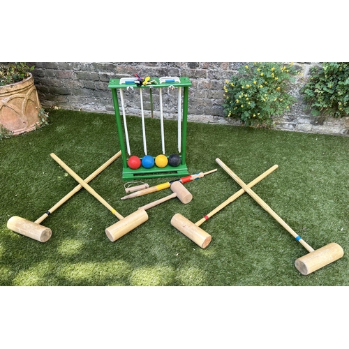 220 - CROQUET SET, a vintage set on portable stand, 46cm x 99cm H.