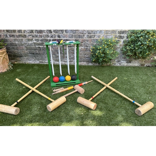 220 - CROQUET SET, a vintage set on portable stand, 46cm x 99cm H.