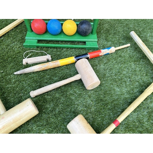 220 - CROQUET SET, a vintage set on portable stand, 46cm x 99cm H.