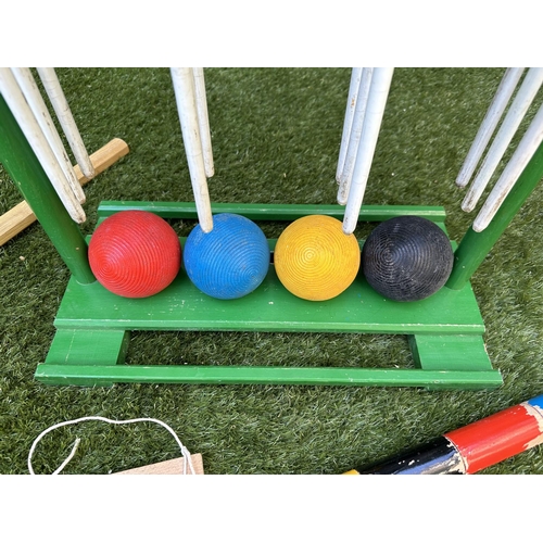 220 - CROQUET SET, a vintage set on portable stand, 46cm x 99cm H.