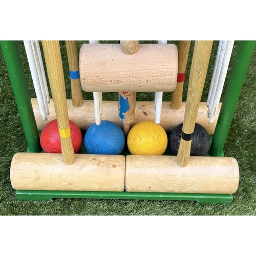 220 - CROQUET SET, a vintage set on portable stand, 46cm x 99cm H.