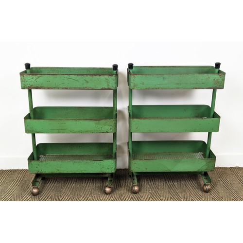 242 - WORKSHOP TROLLEYS, a pair, mid 20th century original green painted metal each with three tiers (on c... 