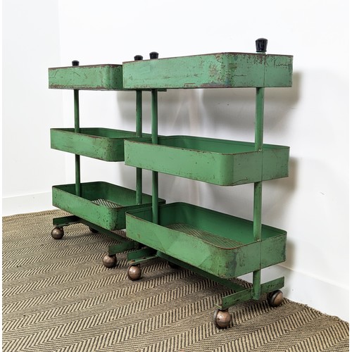 242 - WORKSHOP TROLLEYS, a pair, mid 20th century original green painted metal each with three tiers (on c... 