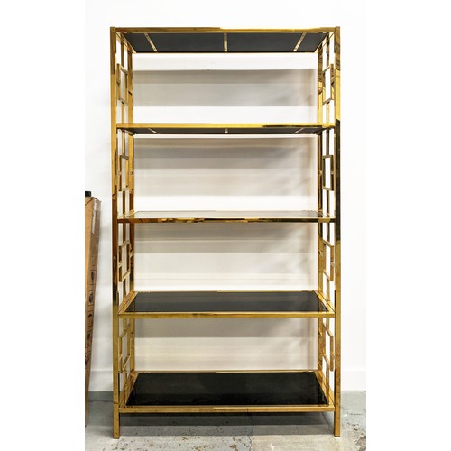 444 - ETAGERE, gilt metal with smoked glass shelves, 195cm H x 107cm x 38cm.