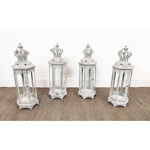 481 - STORM LANTERNS, a set of four, aged metal glazed, 60cm H. (4)