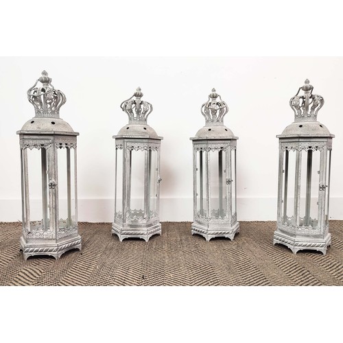 481 - STORM LANTERNS, a set of four, aged metal glazed, 60cm H. (4)