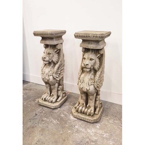 485 - LION PEDESTALS, a pair, composite stone, 78cm H. (2)