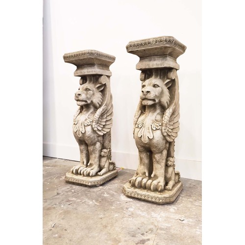 485 - LION PEDESTALS, a pair, composite stone, 78cm H. (2)