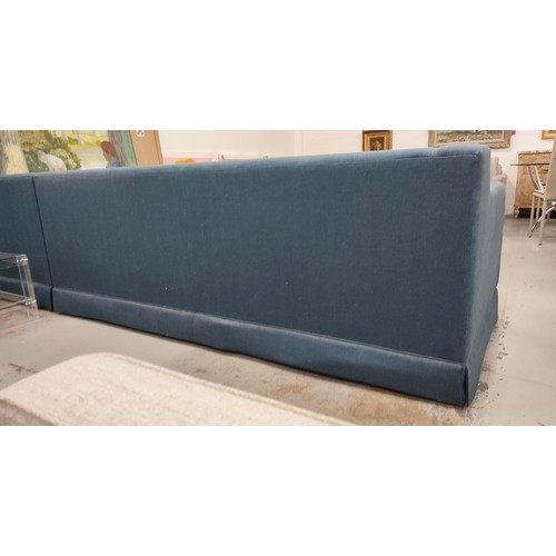 490 - CORNER SOFA, in blue fabric, in three sections, 330cm x 255cm x 84cm.