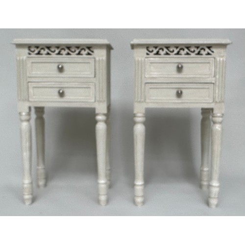 148 - BEDSIDE CHESTS, a pair, French style grey painted each with two drawers and pierced frieze, 40cm x 3... 