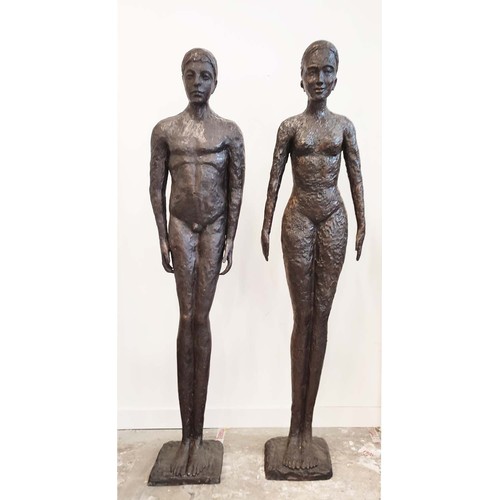 450 - CONTEMPORARY SCHOOL SCULPTURAL MAN AND WOMEN, cast metal, 194cm H. (2)