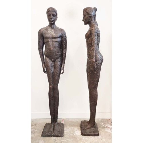 450 - CONTEMPORARY SCHOOL SCULPTURAL MAN AND WOMEN, cast metal, 194cm H. (2)