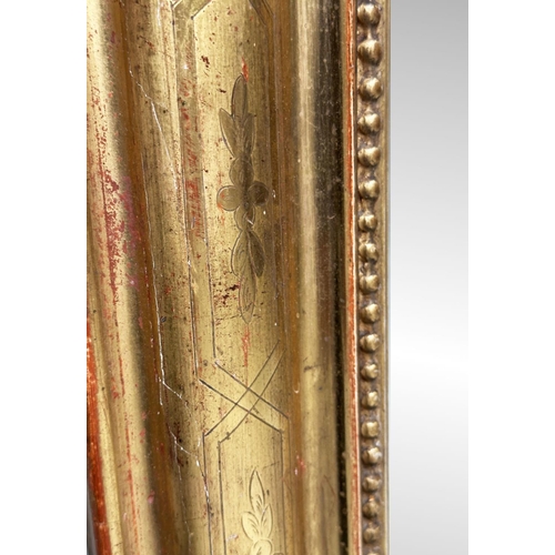 119 - WALL MIRROR, 19th century French giltwood and gesso with arched rectangular beaded and incised frame... 