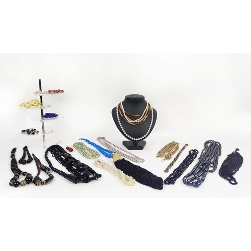 13 - A LARGE QUANTITY OF ASSORTED COSTUME JEWLLERY, including faux pearl necklaces, reconstituted glass b... 