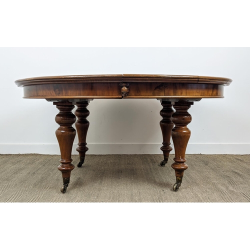 141 - DINING TABLE, Victorian mahogany with oval top and two extra leaves on brass castors, 74cm H x 136cm... 