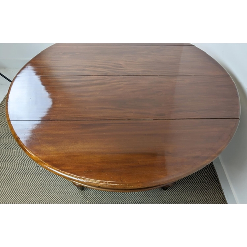 141 - DINING TABLE, Victorian mahogany with oval top and two extra leaves on brass castors, 74cm H x 136cm... 