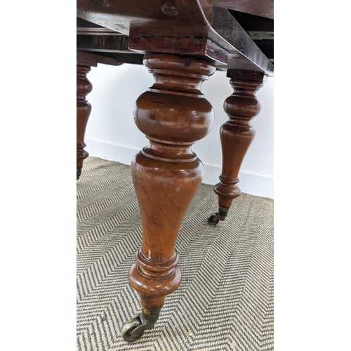 141 - DINING TABLE, Victorian mahogany with oval top and two extra leaves on brass castors, 74cm H x 136cm... 