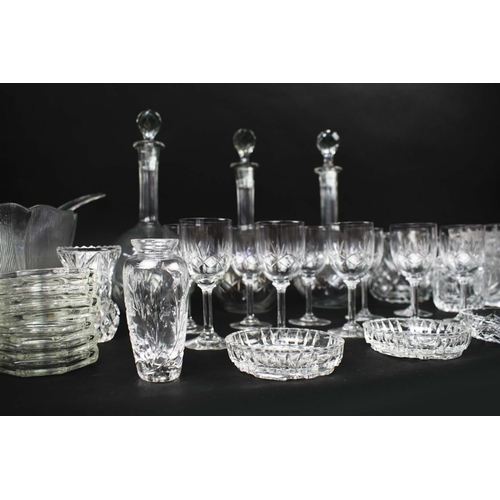 16 - A COLLECTION OF ASSORTED GLASSWARE, comprising twelve small dishes, three shaft and globe decanters ... 