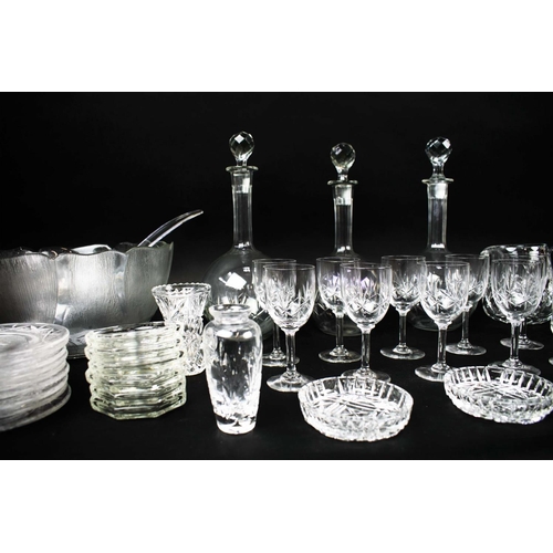 16 - A COLLECTION OF ASSORTED GLASSWARE, comprising twelve small dishes, three shaft and globe decanters ... 