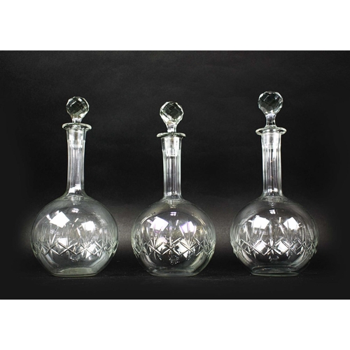 16 - A COLLECTION OF ASSORTED GLASSWARE, comprising twelve small dishes, three shaft and globe decanters ... 