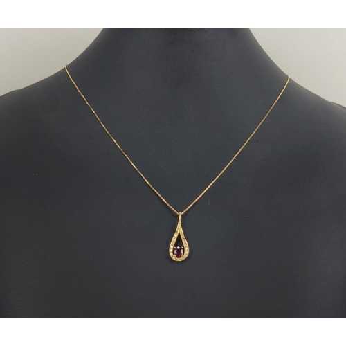 8 - AN 18CT GOLD RED STONE AND DIAMOND SET PENDANT NECKLACE, the oval mixed cut stone with a tear shaped... 