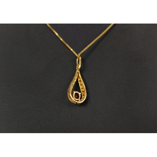 8 - AN 18CT GOLD RED STONE AND DIAMOND SET PENDANT NECKLACE, the oval mixed cut stone with a tear shaped... 