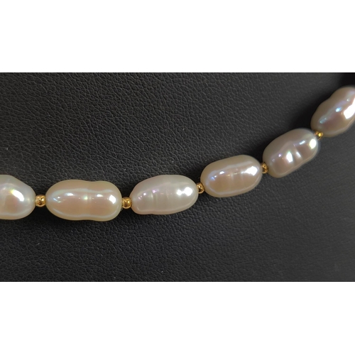 9 - A FRESHWATER PEARL SINGLE STRAND NECKLACE, the pearls of oblong form, with an 18ct gold clasp, 53cm ... 