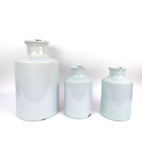 10 - A COLLECTION OF BOTTLE VASES, three celedon with craquelure glaze and two powder blue. (5)