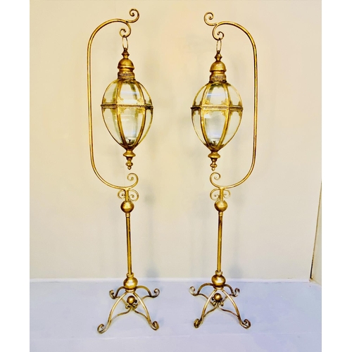 354 - FLOOR STANDING LANTERNS, a pair, gilt metal with stands, 120cm H x 36cm. (2)