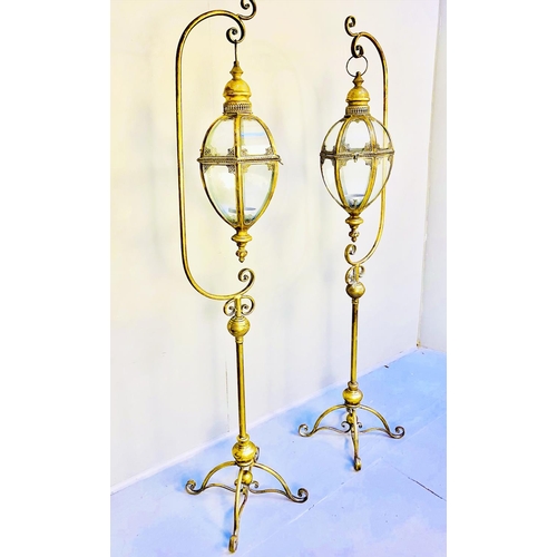 354 - FLOOR STANDING LANTERNS, a pair, gilt metal with stands, 120cm H x 36cm. (2)