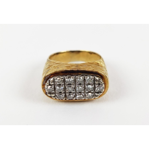 22 - A YELLOW METAL AND DIAMOND SET DRESS RING, set with three rows of round brilliant cut diamonds, rust... 