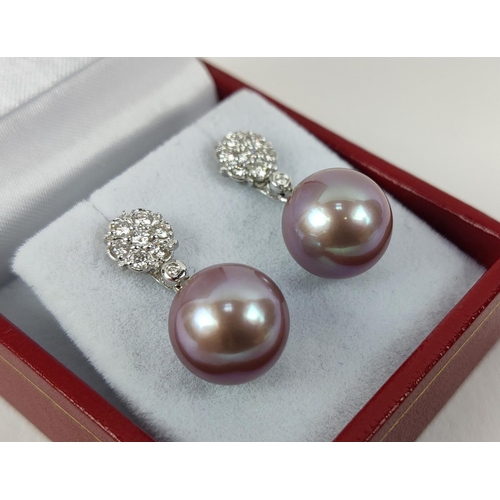 27 - A PAIR OF 18CT WHITE GOLD PEARL PENDANT EARRINGS, the studs set with round brilliant cut diamonds, t... 