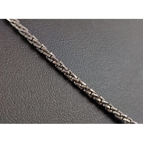 29 - A WHITE METAL CHAIN WITH A DECORATIVE DIAMOND ENCRUSTED CLASP, the clasp with rough cut diamonds to ... 