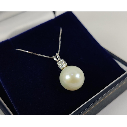 34 - A PEARL AND DIAMOND SET PENDANT NECKLACE, 9ct white gold chain, the pearl of 11mm diameter, the roun... 