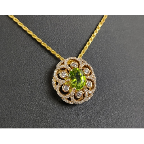 35 - A 14CT GOLD PERIDOT AND DIAMOND PENDANT, the central oval cut peridot of approximately 1.80 carats, ... 