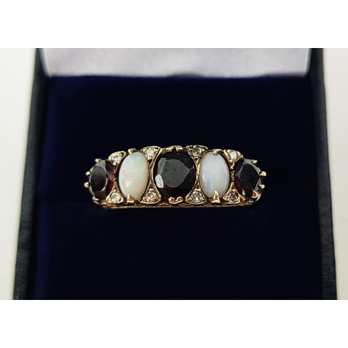 37 - A VICTORIAN STYLE GARNET AND OPAL DRESS RING, 9ct gold shank, set with three oval cut garnets, inter... 