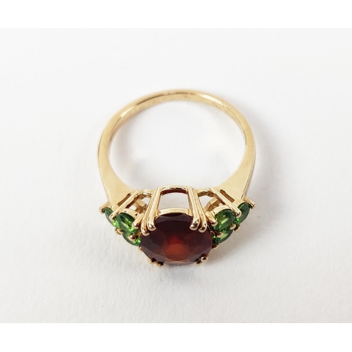 41 - A SPESSARTINE GARNET AND GREEN STONE DRESS RING, 9ct gold shank, the central mixed cut stone surroun... 