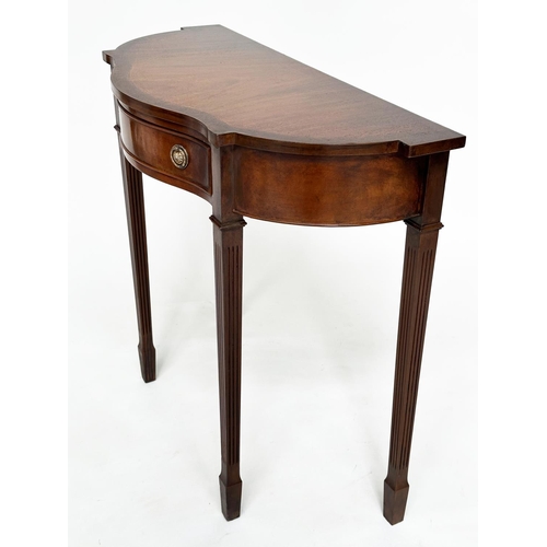 140 - HALL TABLE, George III design, flame mahogany of serpentine outline with frieze drawer and tapering ... 