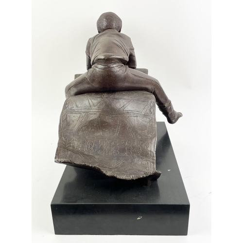 4 - BRONZE BOY ON CARPET, manner of Patrick Comerford, signed D.B. and numbered 1/10 86, 40cm H x 45cm L... 