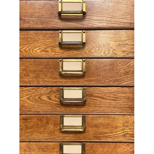 99 - FILING CHEST, mid 20th century oak with eighteen drawers and brass labels/handles, stamped 'ER' Gove... 