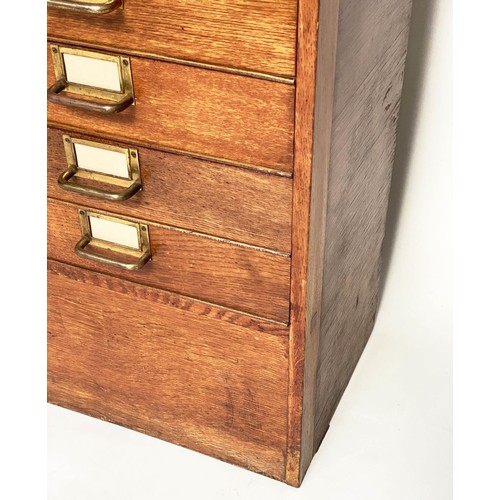 99 - FILING CHEST, mid 20th century oak with eighteen drawers and brass labels/handles, stamped 'ER' Gove... 