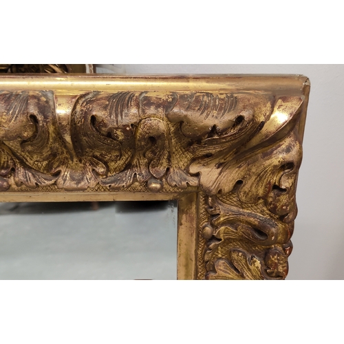 100 - WALL MIRROR,  Victorian carved giltwood with a rectangular plate, 82cm x 64cm.