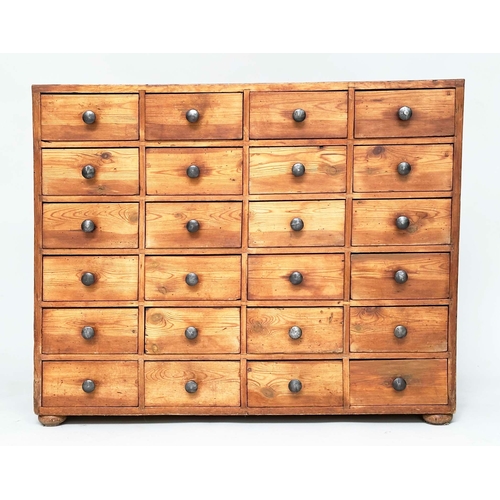 117 - BANK OF DRAWERS, an early 20th century pine bank of twenty four drawers, 106cm W x 28cm D x 84cm H.