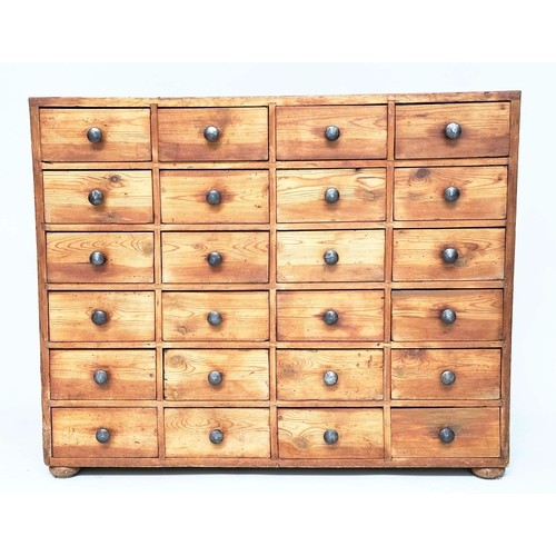 117 - BANK OF DRAWERS, an early 20th century pine bank of twenty four drawers, 106cm W x 28cm D x 84cm H.